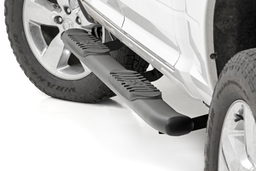 Oval Nerf Side Steps with 4.5-Inch Step Surface shown installed, Rough Country 21003