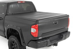 Hard Low-Profile Tri-Fold Bed Cover for Toyota Tundra (2007-2021) shown installed, Rough Country 47414550B