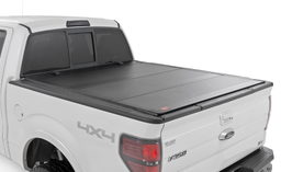 Hard Tri-Fold Flip Up Bed Cover for Ford F-150 (2004–2014) shown installed, Rough Country 49214550