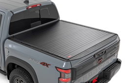 Hard Roll-Up Tonneau Cover for 5' Bed Nissan Frontier (2022-2025) shown installed, Rough Country 50215522