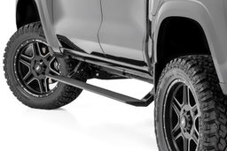 Power Running Boards for Colorado & Canyon Crew Cab (2015–2025) shown installed, Rough Country PSR92010