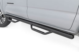 Nerf Step Bars for Toyota Tacoma Double Cab (2005-2023) shown installed, Rough Country RCT0580CCB